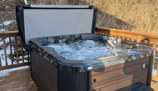 Private deck with hot tub and fire pit.