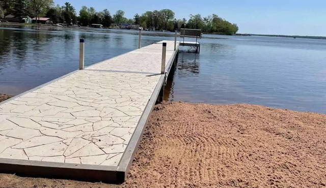 Private Dock, Private Sand Beach and Shawano Lake's Only Boathouse Bar with a TV