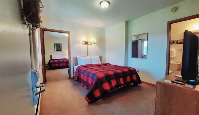 Private family style, corner room in our Lodge at North Ironwood Acres resort offering a sunrise view. 3 beds. 2 bathrooms. DOG FRIENDLY!