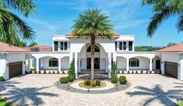 Private, gated 8-bedroom oasis with 6 car garage in prestigous Southwest Ranches