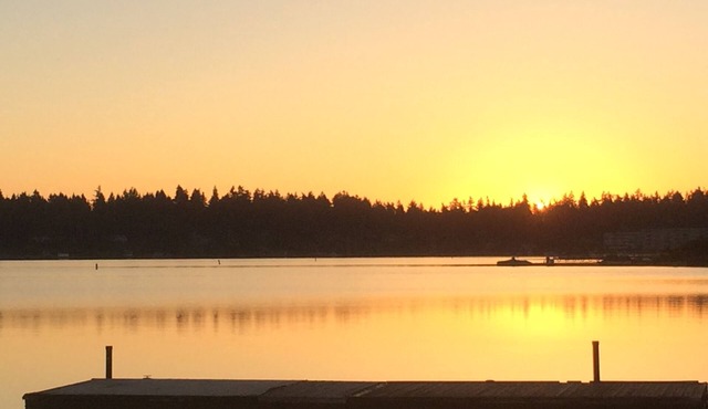 Private Gated Water Front Home on American Lake. Private beach and dock.