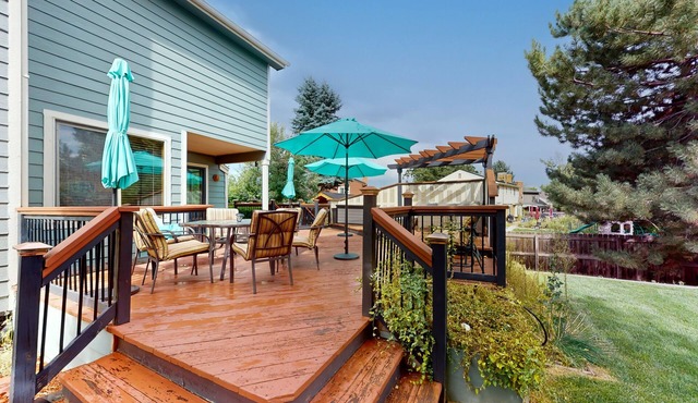 Private home with fenced yard, deck, fireplace, home office, & great location
