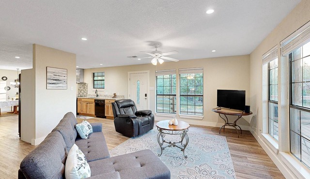 Private home with hill country views, open layout, W/D, central AC, & patio