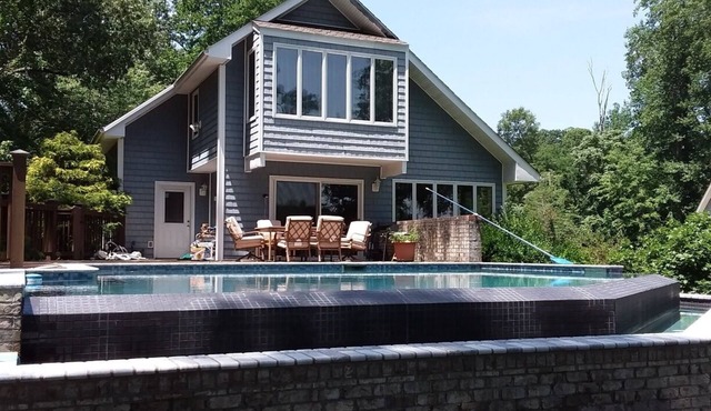 Private infinity pool, plus your own dock, kayaks, and bikes on the waterfront!