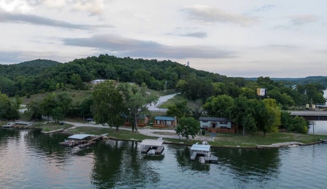 Private Island Retreat with 500' Level Lakefront & 3 Houses with Private Docks!