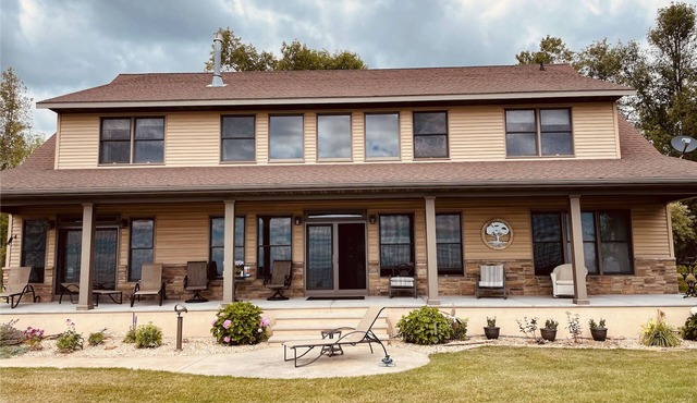 Private lakefront home with 1,200 feet of sandy beach. A year-round retreat.