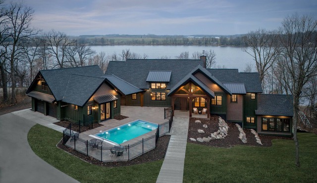 Private lakeside retreat with pool, hot tub, and sauna