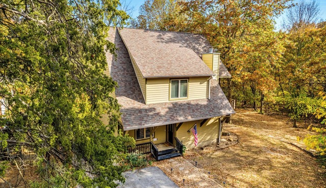 PRIVATE LODGE on acreage in the woods just STEPS away from The UofA!
