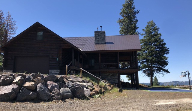 Private Log Cabin with breathtaking views on 15 acres adjacent to forest service