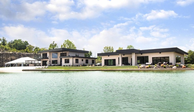 Private luxury 20-acre estate featuring a white sand beach and 8-acre lake