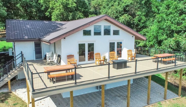 Private, modern home with river view, on 48 acres