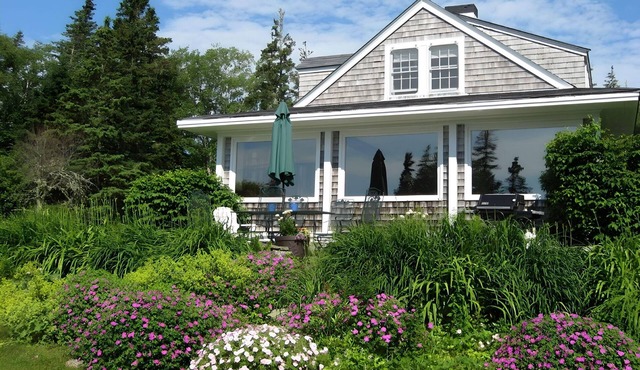 Private oceanfront view just steps from the rocks! Family-owned, dog-friendly.