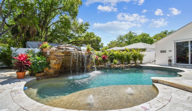 Private Pool with waterfall and swim up bar at The Palm by DNY Prime