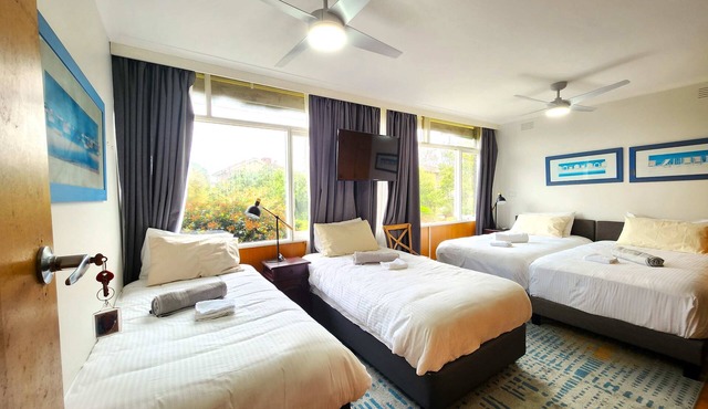 Private quad guest room with full kitchen and free parking