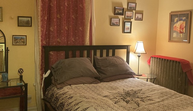 Private room in shared home with full kitchen, living room, and yoga space.