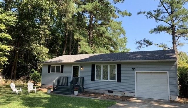 Private single family home with a natural wooded setting providing much privacy.