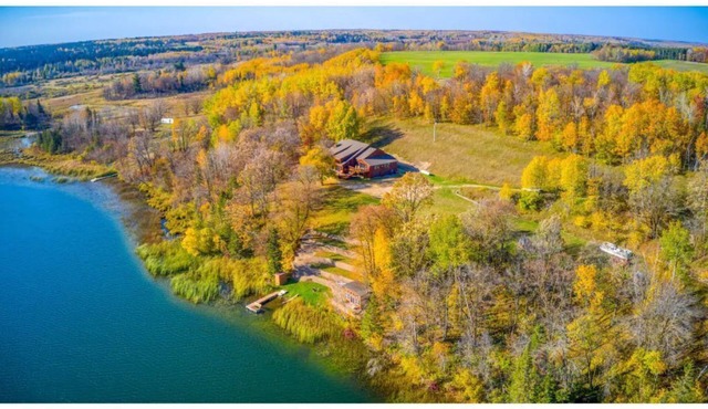 Private, Spacious, 10,000 Sq Ft Custom Built Lake Home w/Lakeside Cabin & 73 ac