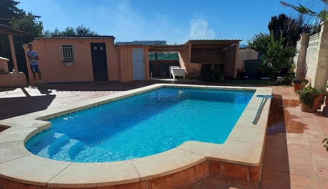 Private villa with heated pool close to the beach.