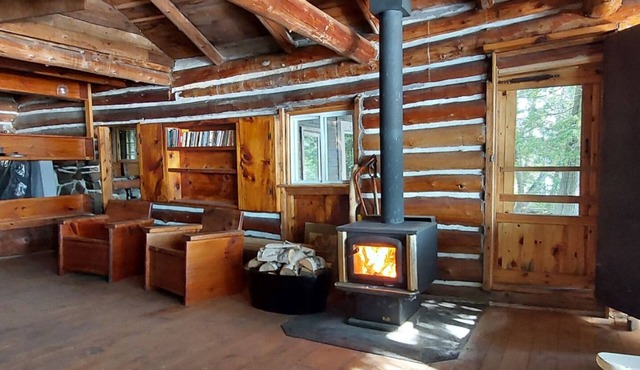 Private water (boat) access, rustic offgrid log cabin on class five lake.