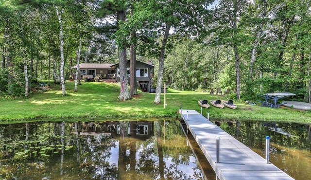 Private waterfront home with dock, kayaks, firepit, & open layout - dog-friendly