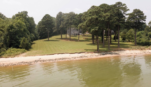 Private waterfront escape with endless river views, white sand beach and more!