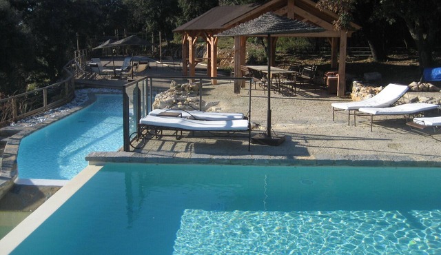 Property with 2 swimming pools and tennis court, surrounded by nature