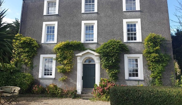 Property looking at Dylan Thomas boat house and Laugharne Castle.