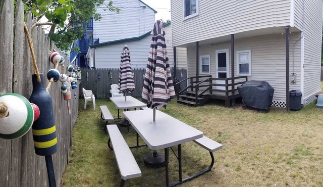 Quaint 2 bedroom cottage across the street from the beach with private yard.