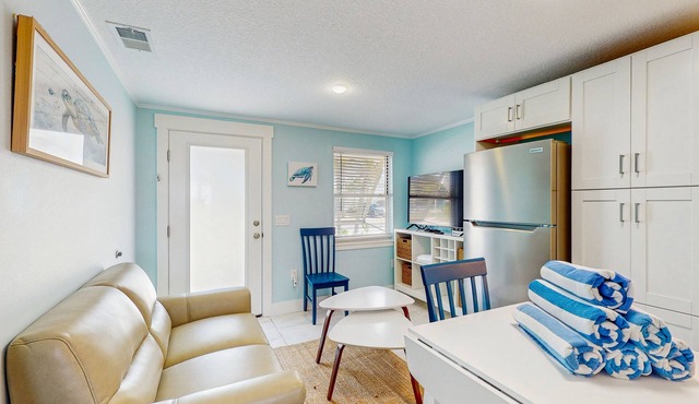 Quaint beachfront duplex in ideal location with screened lanai & free trolley