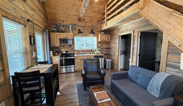 Quaint cottage with 3 queen beds and screened porch.