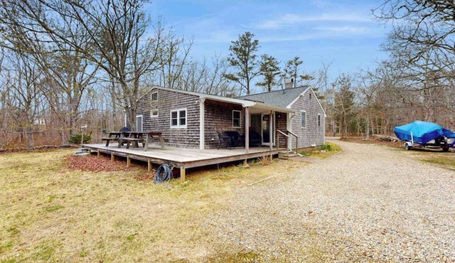 Quaint home across from bike paths with large furnished deck, grill, & W/D