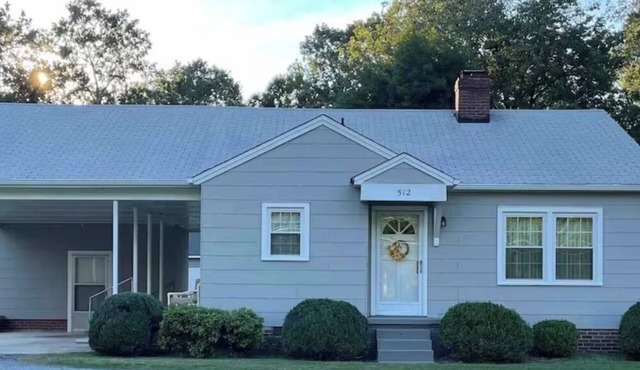 Quaint mid- century home with a great porch to relax on and enjoy nature.