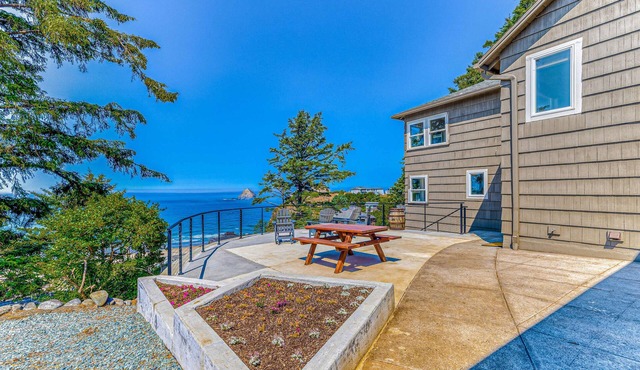 Quaint ocean view escape with modern interior smart TV and gorgeous deck