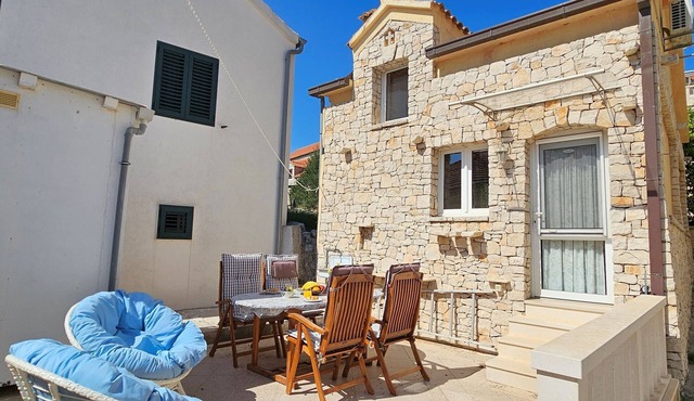 Quaint old stone cottage with large terrace just 150m from the beach