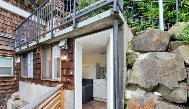 Quaint studio in a great location with partial water views & a peaceful patio