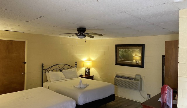 Queen Guest Room located at the Joplin Inn on the highway at the entrance to Mountain Harbor, 2 1/2 miles from Lake Ouachita. by RedAwning