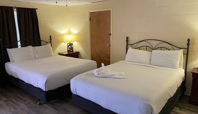 Queen Guest Room located at the Joplin Inn at the entrance to Mountain Harbor, , just 2 1/2 miles from Lake Ouachita. by RedAwning