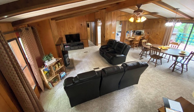 Quiet cabin in the woods w/access to pools, river, & lakes in gated community!