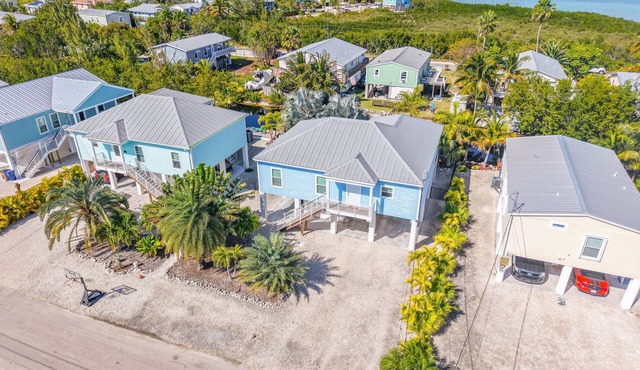 Quiet Canal Hideaway | Tropical Landscaping, Breezy Porch, Relaxing Keys Living