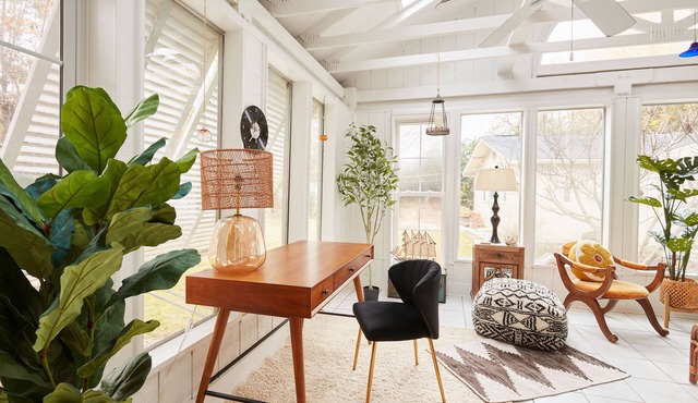 Quiet home with sunroom, modern amenities, fenced in yard, EV Charging, & more!