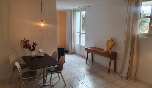 Quiet, large garden apartment with free parking space