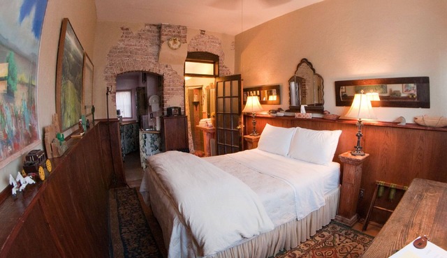 Quiet room in historic hotel, with queen bed, attached bath and kitchenette.