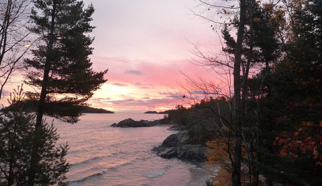Quiet, secluded oasis with 300 ft of Lake Superior beach and 10 wooded acres.
