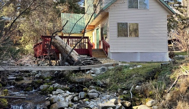 Quiet streamside retreat Hot Tub Deck overlooking the creek Wood-burning stove Tucked below Sundance