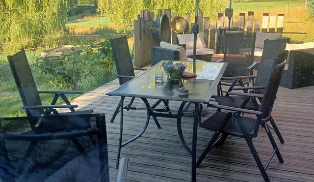 Quiet wooden cottage on the riverbank