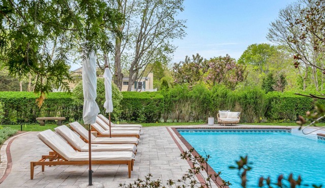 Quintessential Hamptons home with 6 bedrooms (all ensuite bathrooms), open.