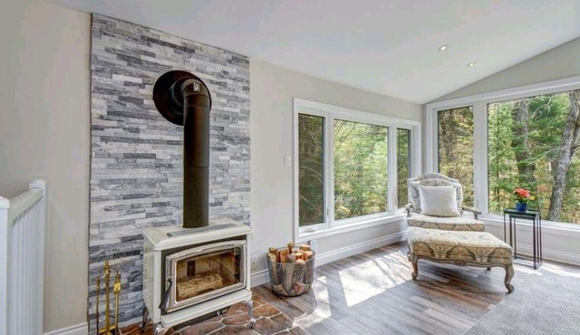 Quite luxury in a Tranquil cottage on a forested property with a waterfall.