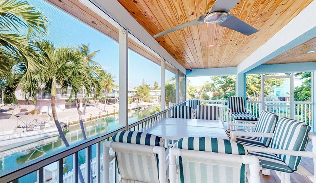 Radiant waterfront retreat with remarkable views, patio, tennis court, & grill