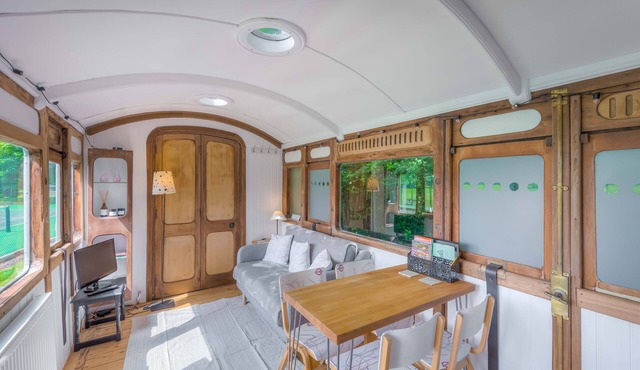 Railway carriage accommodation with tennis court!