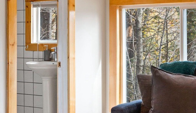 Rarely offered 2 waterfront cottages with 2 hot tubs side by side!